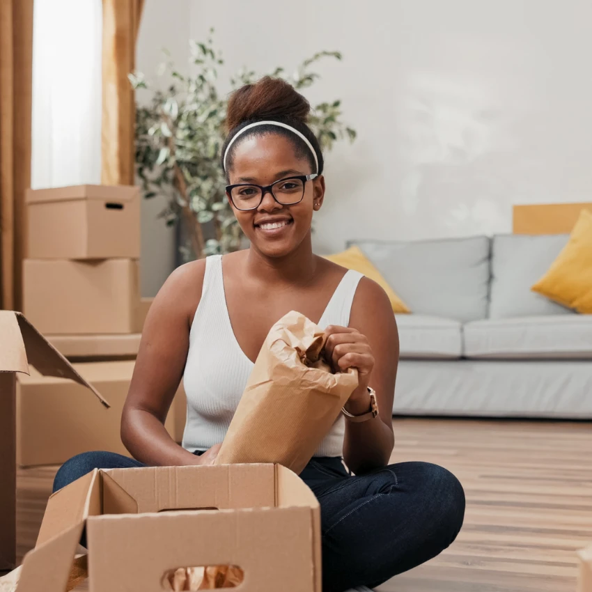 Student packing boxes for seasonal storage